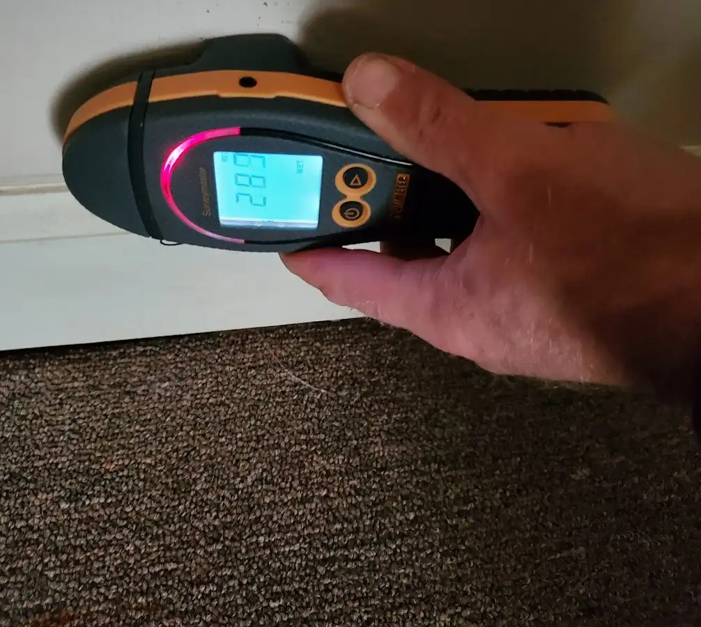 Moisture detection at baseboard during Storm Damage Restoration in Damascus